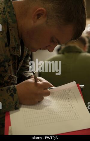 U.S. Marines Corps Pfc. Matthew T. Babcock, an aircraft electrical systems technician assigned to Marine Fighter Attacks Squadron 251, signs out tools for maintenance during Red Flag-Alaska 17-2 on Joint Base Elmendorf-Richardson, Alaska, June 19, 2017. Red Flag-Alaska provides an optimal training environment in the Indo-Asian Pacific region and focuses on improving ground, space, and cyberspace combat readiness and interoperability for U.S. and international forces. Stock Photo