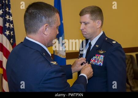 Lt. Col. Brett DeAngelis takes command of the 1st Special Operations Air Operations Squadron from Lt. Col. Aaron Ffrench during a Change of Command ceremony at Hurlburt Field, Fla., June 20, 2017. Stock Photo