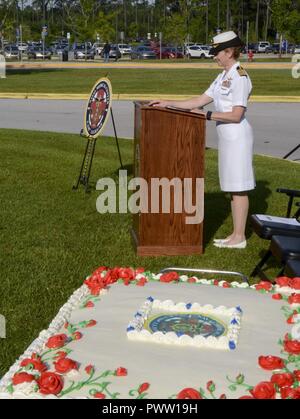 CAMP LEJEUNE, NC -- Captain Shelley Perkins, executive officer of Naval Medical Center Camp Lejeune served as the emcee for the ribbon cutting ceremony marking the renaming of Naval Hospital Camp Lejeune to Naval Medical Center Camp Lejeune, June 27, 2017.  The ceremony was the formal recognition of years of growth and hard work by the thousands of Corpsmen, nurses, doctors, civilian sailors and staff who’ve served at the hospital. Originally built in 1983, the current hospital has grown significantly over the last decade adding new services such as operating the Navy’s only Level II Special C Stock Photo