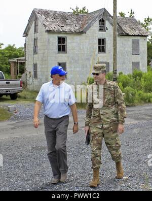 Col. Ed Chamberlayne, U.S. Army Corps of Engineers, Baltimore District commander, speaks to Bill Anderson, Maryland Department of Natural Resources assistant secretary, during a site visit along with Somerset County officials to discuss a future navigation improvement project at Rhodes Point on Smith Island, Maryland, June 22, 2017. Stock Photo