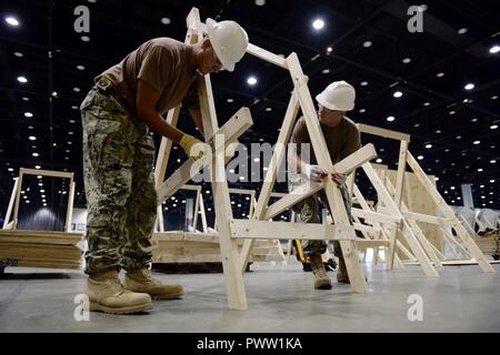 CHICAGO (June 27, 2017) From left, Electronics Technician 2nd Class Charles Stephens, of Navy Operational Support Center Austin, and Equipment Operator 2nd Class (SCW/EXW) Jeremy Gray, of Navy Cargo Handling Battalion 10, build archery targets for the 2017 Department of Defense Warrior Games. The DoD Warrior Games are an annual event allowing wounded, ill and injured service members and veterans to compete in Paralympic-style sports including archery, cycling, field, shooting, sitting volleyball, swimming, track and wheelchair basketball. Stock Photo