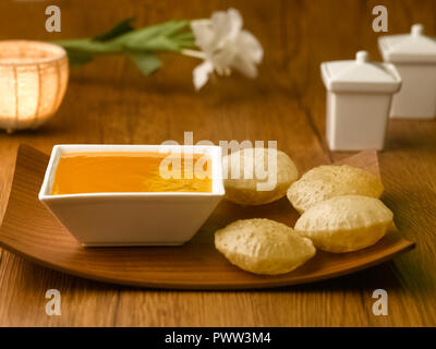 MANGO JUICE/ AAM RAS AND PURI/ PURI, FRIED PUFFED BREAD MADE FROM WHEAT Stock Photo