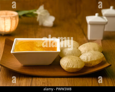 MANGO JUICE/ AAM RAS AND PURI/ PURI, FRIED PUFFED BREAD MADE FROM WHEAT Stock Photo