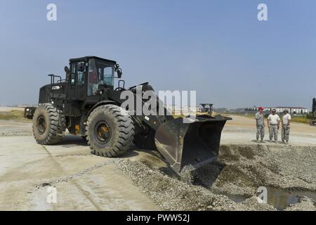 U.S. Air Force’s 554th Red Horse Squadron’s crater repair team repairs ...