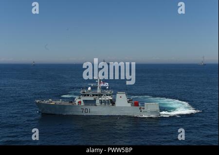 ATLANTIC OCEAN (June 27, 2017) The Royal Canadian Navy Kingston-class maritime coastal defense vessel HMCS Glace Bay (MM 701) transits the Atlantic Ocean during a photo exercise with the aircraft carrier USS Dwight D. Eisenhower (CVN 69)(Ike), the Arleigh Burke-class guided-missile destroyer USS Winston S. Churchill (DDG 81), the guided-missile cruiser USS San Jacinto (CG 56), the Military Sealift Command dry cargo and ammunition ship USNS Robert E. Perry (T-AKE 5), the Royal Canadian Navy frigate HMCS Charlottetown (FFH 339), and the Royal Canadian Navy Kingston-class maritime coastal defense Stock Photo