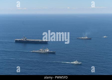 ATLANTIC OCEAN (June 27, 2017) The aircraft carrier USS Dwight D. Eisenhower (CVN 69), the Arleigh Burke-class guided-missile destroyer USS Winston S. Churchill (DDG 81), the guided-missile cruiser USS San Jacinto (CG 56), the Royal Canadian Navy Kingston-class maritime coastal defense vessel HMCS Glace Bay (MM 701) and the Royal Canadian Navy Kingston-class maritime coastal defense vessel HMCS Moncton (MM 708) transit the Atlantic Ocean. The ships are underway conducting a bilateral group sail with the Canada 150 anniversary celebration. ( Stock Photo