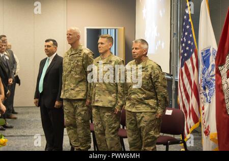 Col. Paul E. Owen took command of the Southwestern Division today in a ceremony officiated by Lt. Gen. Todd T. Semonite, Chief of Engineers and Commanding General of the U.S. Army Corps of Engineers.    The official party (left) Mark L. Mazzanti, SES Director of Programs, Southwestern Division, SWD incoming Commander Col. Paul E. Owen, SWD outgoing Commander Brig. Gen. David C. Hill, USACE Commander Lt. Gen. Todd T. Semonite. Stock Photo