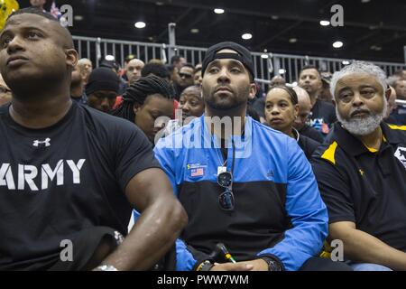 U.S.Army Sgt. Christopher McGinnis, from Bethesda, Maryland, listens to a briefing for the 2017 Department of Defense Warrior Games at Chicago, Ill., June 29, 2017. The DOD Warrior Games are an annual event allowing wounded, ill and injured service members and veterans in Paralympic-style sports including archery, cycling, field, shooting, sitting volleyball, swimming, track and wheelchair basketball. Stock Photo