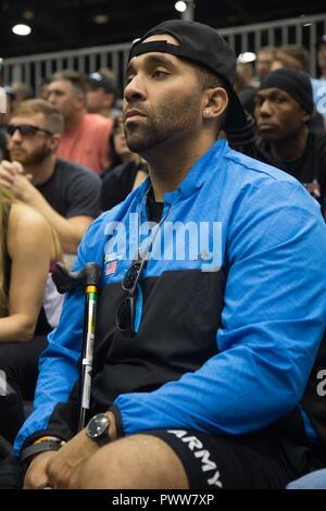 U.S. Army Sgt. Christopher McGinnis, from Bethesda, Maryland, attends the welcome brief for the 2017 Department of Defense Warrior Games at Chicago, Ill., June 29, 2017. The DOD Warrior Games are an annual event allowing wounded, ill and injured service members and veterans in Paralympic-style sports including archery, cycling, field, shooting, sitting volleyball, swimming, track and wheelchair basketball. Stock Photo