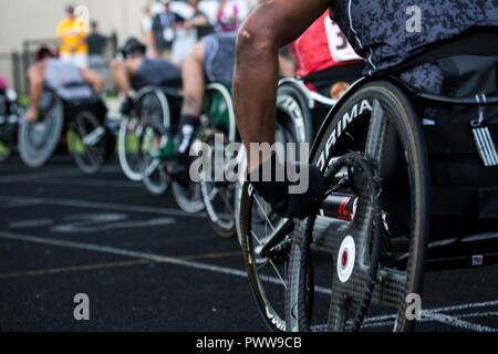 U.S. Military soldiers and veterans athletes line up for wheelchair racing bike event for the 2017 Department of Defense Warrior Games at Chicago, Ill., July 2, 2017. The DOD Warrior Games are an annual event allowing wounded, ill and injured service members and veterans in Paralympic-style sports including archery, cycling, field, shooting, sitting volleyball, swimming, track and wheelchair basketball. Stock Photo