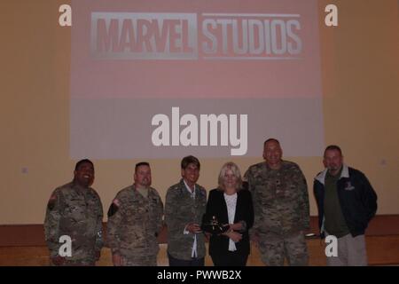 Battle Group Poland Commander, Lt. Col. Steven Gventer and Command Sergeant Major Joe Chadwick pose with Sony Senior Vice President Rana Matthes (fourth from left), AAFES Regional Vice President Elizabeth A. Goodman-Bluhm (third from left) and AFFES Sergeant Major Eliecer M. Quintero, Jr. prior to an advance screening of the new Spiderman Homecoming movie exclusively for the soldiers at Bemowo Piskie Training Area June 30.  The unique, multinational formation of U.S., U.K. and Romanian soldiers serve with the Polish 15th Mechanized Brigade as a deterrence force in northeast Poland in support o Stock Photo
