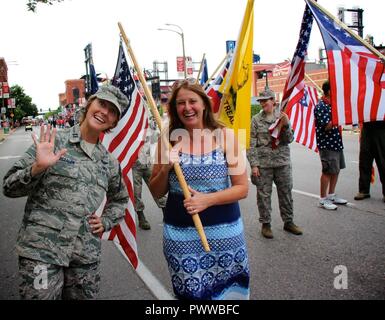 Capt. Elizabeth Wszalek, 932nd Airlift Wing executive officer during the week, and 932nd Force Support Squadron Manpower and Personnel Flight commander on drill weekends, joined up with volunteers Stephanie Smith and Master Sgt. Karen Ridge, along with other Airmen to celebrate America's Independence Day.  They walked through the streets of Saint Louis as part of America's Birthday VP parade on July 1, 2017. Stock Photo