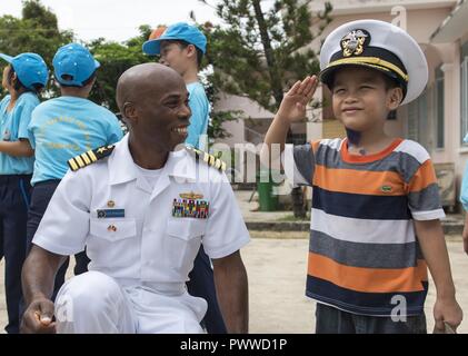 NHA TRANG, Vietnam (July 6, 2017) Capt. Lex Walker, commodore, Destroyer Squadron 7, interacts with a resident of Khanh Hoa Center for Social Protection during Naval Engagement Activity (NEA) Vietnam 2017 July 6. The engagement provides an opportunity for Sailors from the U.S. and Vietnam People's Navy to interact and share knowledge to enhance mutual capabilities and strengthen solid partnerships with the local community. ( Stock Photo