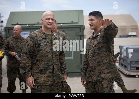 From left to right) Sgt. Maj. Carlos A. Ruiz, sergeant major of Marine  Forces Reserve and Marine Forces South, Rico Alvendia, the captain of the  Legion of Mars, Lt. Gen. David G.