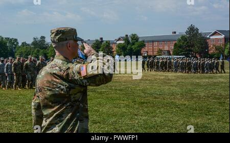 FORT MEADE, Md. -- Lt. Col. Eric S. Fowler, the new commander of the Army's largest military intelligence battalion, 741st MI, salutes his formation during a Pass in Review, June 30, during a change of command ceremony. Stock Photo