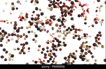 Different peppers isolated on white background (black, red, green and white peppercorns) Stock Photo