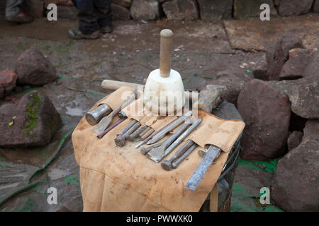 Stone working tools including, hammer, mallet, chisels in a carrying bag. Stock Photo