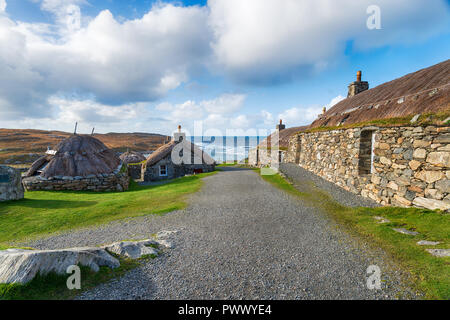 Traditional thatched crofts at Gearrannan Blackhouse Village at Carloway on the Isle of Lewis  in the Outer Hebrides in Scotland Stock Photo