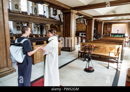 London England,UK,West End St James's Piccadilly Church,St James-in-the-Fields,Anglican Church parish,interior inside,rector,woman female women,talkin Stock Photo