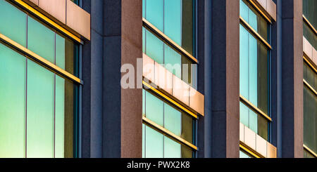 Modern building with glass windows on a sunny day Stock Photo