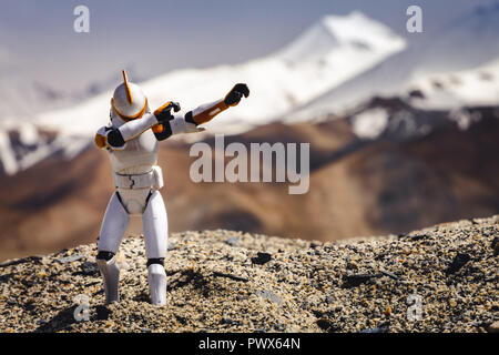 Star Wars Clone Trooper doing the dab at the Pangong Lake in Leh, India with the Himalayans Mountain Range in the background. Stock Photo
