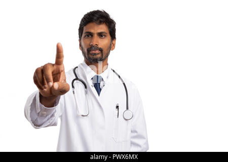 Indian medic or doctor touching invisible display as copyspace with index finger isolated on white background Stock Photo