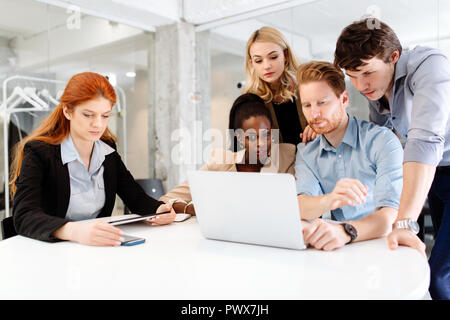 Business people collaborating in office and working on project together Stock Photo