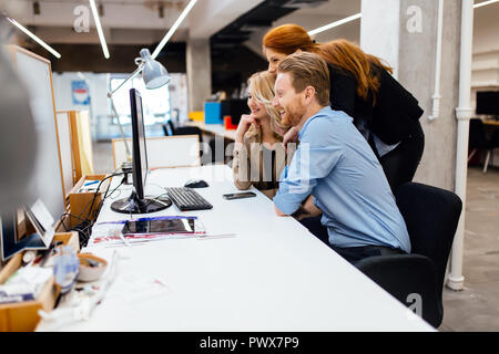 Business people collaborating in office and working on project together Stock Photo