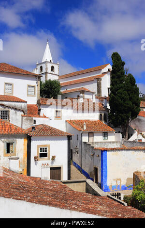 Portugal, Obidos. Rooftops and whitewashed facades of the medieval town. Obidos is a excellent example of conservation and sustainable tourism. Stock Photo