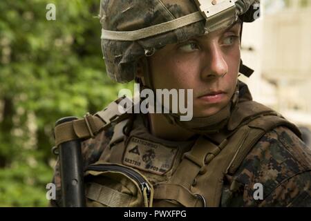 U.S. Marine Corps Cpl. Kyler Goeglein, left, and U.S. Marine Corps Cpl ...