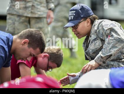 U.S. Air Force Reserve Tech. Sgt. Kristen Howard, a member of the 910th Medical Squadron, supervises Junior Reserve Officer Training Corps (JROTC) cadets doing physical training during an encampment here, June 21, 2017. The encampment, facilitated by 910th Airlift Wing Airmen, provided a five-day experience teaching military skills and replicating aspects of Basic Military Training. JROTC is a program sponsored by the Armed Forces for high school students across the country. Stock Photo