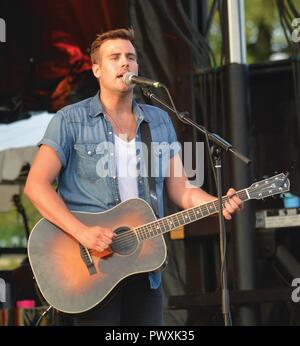 Up-and-coming country music artist Jackie Lee performs for the rapidly  growing crowd at Fort Lee's Fourth at the Fort celebration in Williams  Stadium. The 25-year-old hails from Maryville, Tenn. His accumulating  musical accolades include the recent hit ...