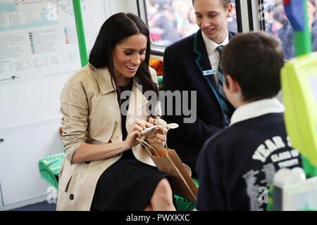 Duchess of Sussex talks to students from Albert Park Primary School, Port Melbourne Primary School and Elwood Secondary College while riding on a tram in Melbourne, on the third day of the royal couple's visit to Australia. Stock Photo