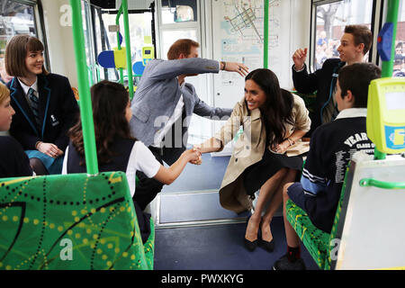 The Duke and Duchess of Sussex talks to students from Albert Park Primary School, Port Melbourne Primary School and Elwood Secondary College while riding on a tram in Melbourne, on the third day of the royal couple's visit to Australia. Stock Photo