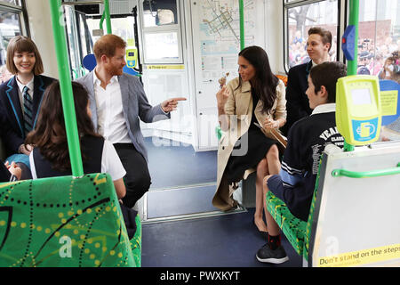 The Duke and Duchess of Sussex talks to students from Albert Park Primary School, Port Melbourne Primary School and Elwood Secondary College while riding on a tram in Melbourne, on the third day of the royal couple's visit to Australia. Stock Photo