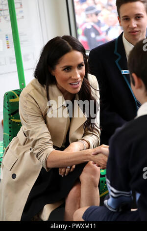 Duchess of Sussex talks to students from Albert Park Primary School, Port Melbourne Primary School and Elwood Secondary College while riding on a tram in Melbourne, on the third day of the royal couple's visit to Australia. Stock Photo