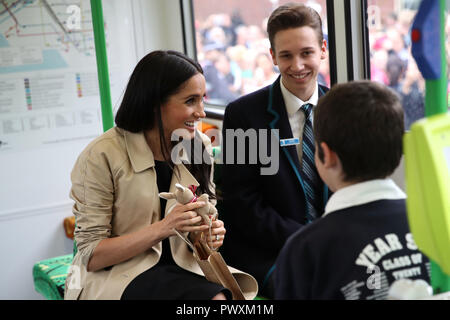 Duchess of Sussex talks to students from Albert Park Primary School, Port Melbourne Primary School and Elwood Secondary College while riding on a tram in Melbourne, on the third day of the royal couple's visit to Australia. Stock Photo