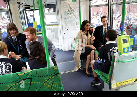 The Duke and Duchess of Sussex talks to students from Albert Park Primary School, Port Melbourne Primary School and Elwood Secondary College while riding on a tram in Melbourne, on the third day of the royal couple's visit to Australia. Stock Photo