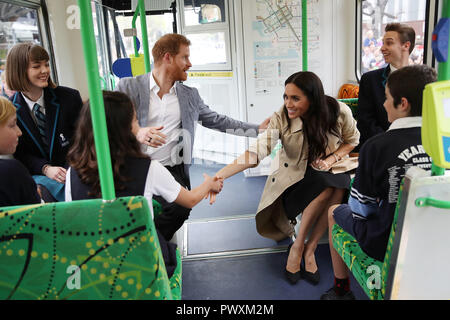 The Duke and Duchess of Sussex talks to students from Albert Park Primary School, Port Melbourne Primary School and Elwood Secondary College while riding on a tram in Melbourne, on the third day of the royal couple's visit to Australia. Stock Photo