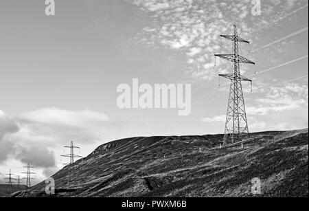Close-up of intrusive roadside electricity pylons on the A9 trunk road, on hillside near the summit of Drumochter Pass, Scottish Highlands, UK. Stock Photo