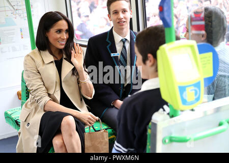 Duchess of Sussex talks to students from Albert Park Primary School, Port Melbourne Primary School and Elwood Secondary College while riding on a tram in Melbourne, on the third day of the royal couple's visit to Australia. Stock Photo