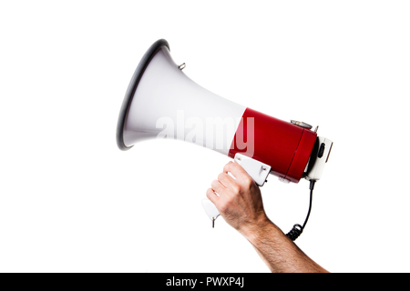 side view of a hand holding a megaphone isolated on white background Stock Photo