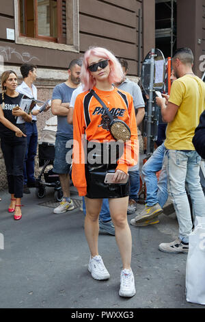 MILAN, ITALY - SEPTEMBER 21, 2018: Woman with white Louis Vuitton bag with  colorful logos before Sportmax fashion show, Milan Fashion Week street styl  Stock Photo - Alamy