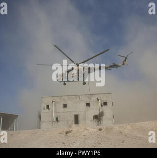 (181018) -- KABUL, Oct. 18, 2018 (Xinhua) -- A helicopter flies over a room during a military exercise at Kabul Military Training Center (KMTC) in Kabul, capital of Afghanistan, on Oct. 17, 2018. As the date for the upcoming Afghan parliamentary elections getting closer, the Afghan Interior Ministry announced the deployment of 50,000-strong troops to ensure security for the polling process. (Xinhua/Rahmat Alizadah) (qxy) Stock Photo