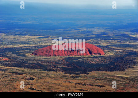 Yulara, Australien. 16th Apr, 2018. View from an airplane on the Uluru/Ayers Rock (second largest monolith of the earth and approx. 600 million years old) in the Uluru Kata Tjuta National Park in Australia, taken on 16.04.2018 | usage worldwide Credit: dpa/Alamy Live News Stock Photo