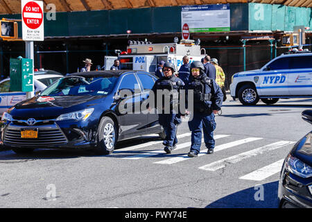 Manhattan Island, New York City, USA, Oct 18th, 2018. Police Isolates School A Philip Randolph High School on Manhattan Island in New York City on Thursday, 18. After receiving reports of suspected firearm among students. Authorities said one student reported that she observed a male student with a firearm. Police said the ensuing investigation revealed that a male student was in possession of what appeared to be a shotgun he had shown to a friend. No one was injured and situation was controlled. (PHOTO: WILLIAM VOLCOV/BRAZIL PHOTO PRESS) Credit: Brazil Photo Press/Alamy Live News Stock Photo