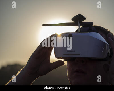 Kiev, Ukraine. 18th Oct, 2018. Drone pilot seen wearing a first-person view headset. Young man driving a quad-copter using video-goggles Credit: Igor Golovniov/SOPA Images/ZUMA Wire/Ģ����ý Live News Stock Photo
