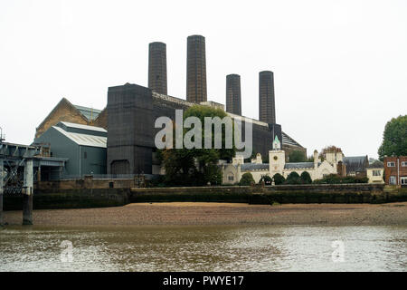 Greenwich Power Station and Trinity Hospital by River Thames Old Woolwich Road Greenwich London England United Kingdom UK Stock Photo