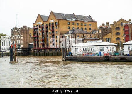 St John's Wharf And The Captain Kidd with Wapping Pier on the River Thames Tower Hamlets London England United Kingdom UK Stock Photo