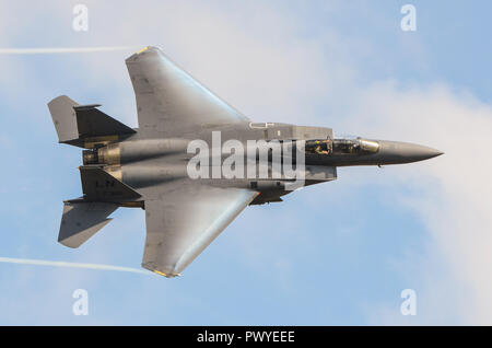 USAF McDonnell Douglas F-15 Eagle fighter at speed with condensation vapour forming on the wings. F-15E Strike Eagle Demo Team Stock Photo